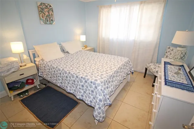 a white toilet sitting next to a bath tub and a shower