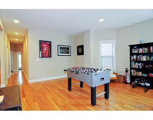 3357 North Seminary Avenue, Unit 1 Chicago, IL 60657 - Photo 4 of 10 a living room with furniture a table and a bookshelf