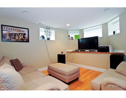 3357 North Seminary Avenue, Unit 1 Chicago, IL 60657 - Photo 5 of 10 a living room with furniture and a flat screen tv