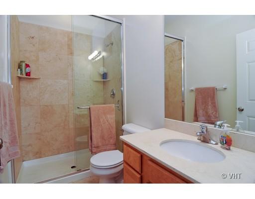3357 North Seminary Avenue, Unit 1 Chicago, IL 60657 - Photo 7 of 10 a bathroom with a sink a toilet and shower