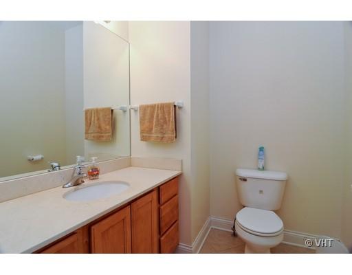 3357 North Seminary Avenue, Unit 1 Chicago, IL 60657 - Photo 8 of 10 a bathroom with a sink toilet and a mirror