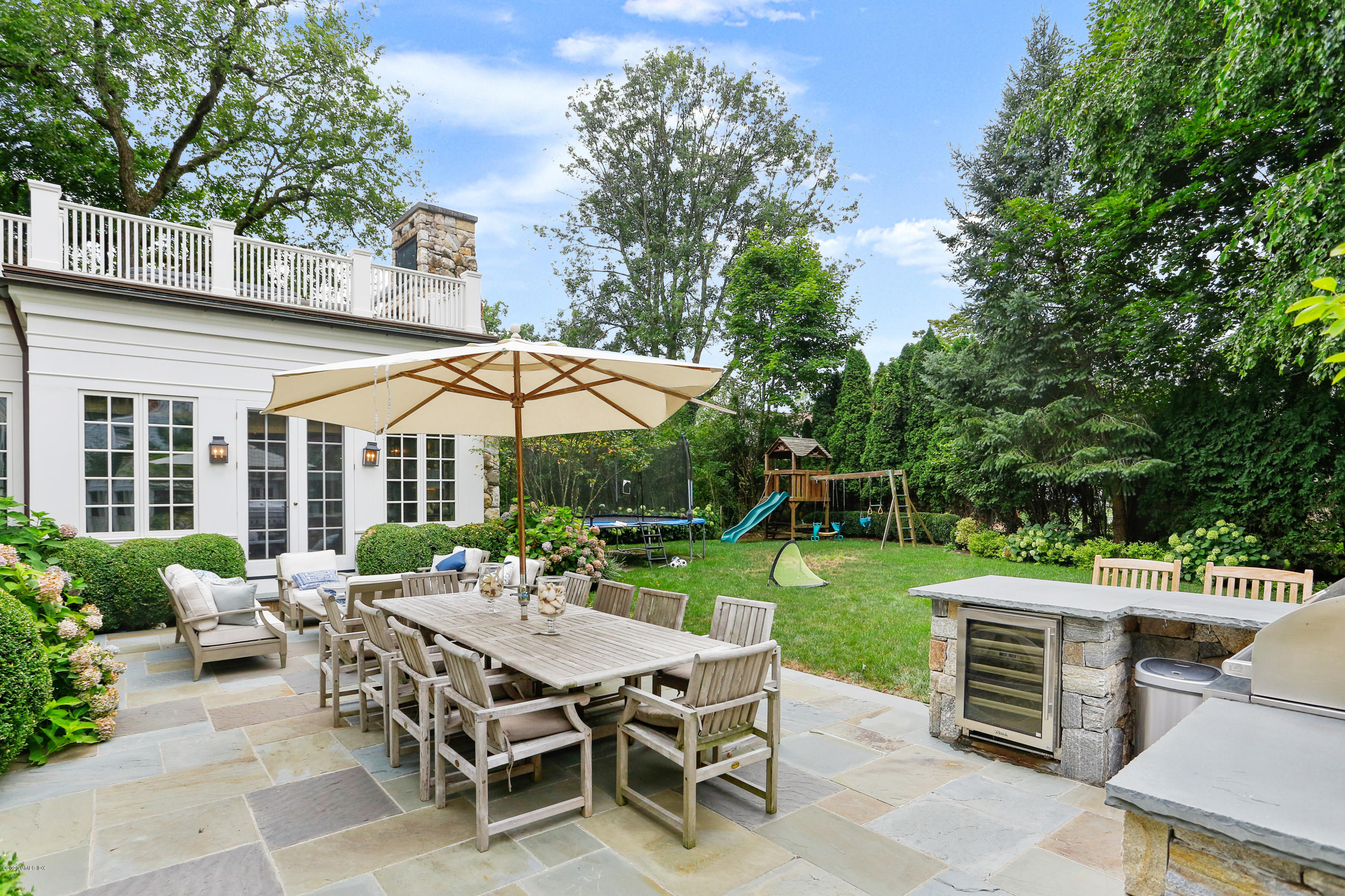 47 Shore Road Old Greenwich, CT 06870 - Photo 3 of 4 an outdoor space with furniture and garden