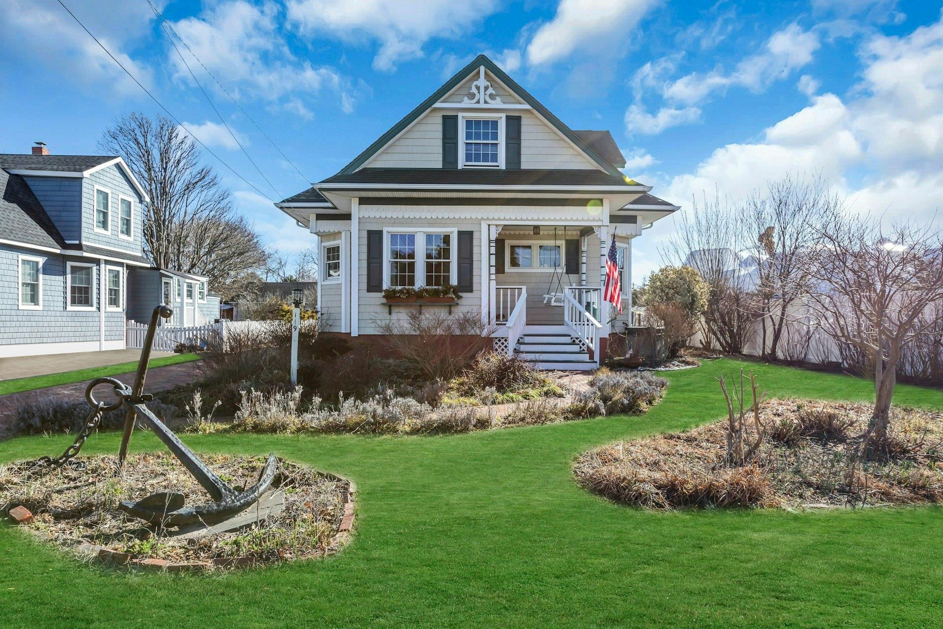 View of front of property with a front yard