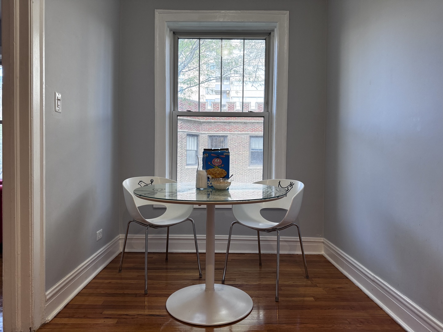 6249 North Sheridan Road, Unit 5 Chicago, IL 60660 - Photo 13 of 32 a view of a dining room with furniture and wooden floor