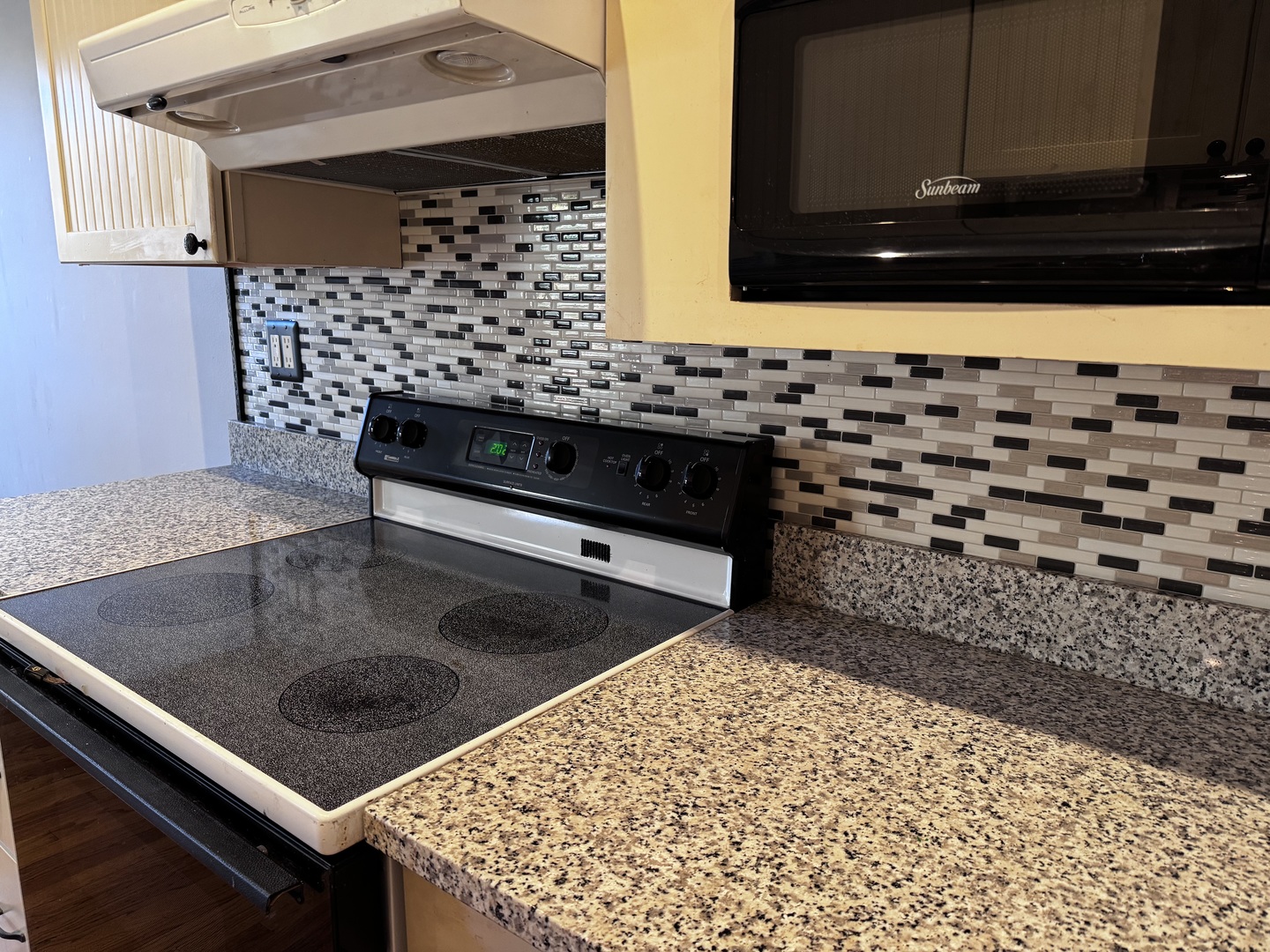 6249 North Sheridan Road, Unit 5 Chicago, IL 60660 - Photo 10 of 32 a kitchen with a sink a stove and cabinets