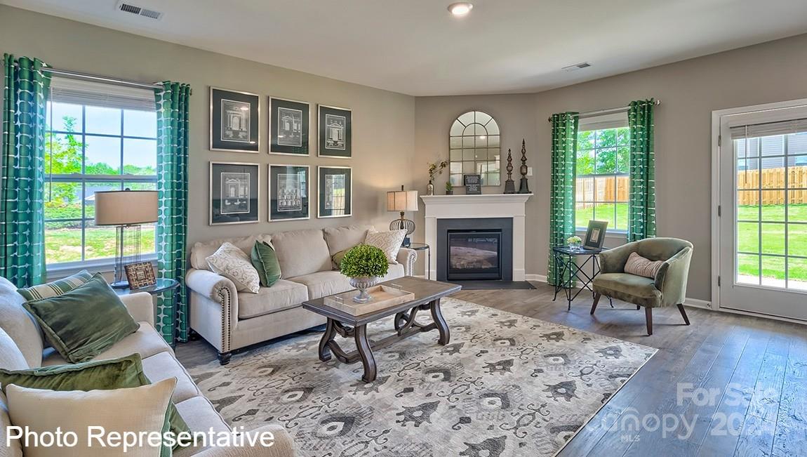 134 Dandelion Road Fletcher, NC 28732 - Photo 12 of 29 a living room with furniture and a fireplace