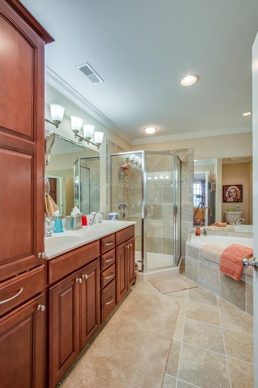 7100 Dale Ridge Road Lancaster, TN 38569 - Photo 15 of 29 Owners' private suite features, a glass shower, double vanity, bevy of cabinetry...