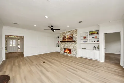 a view of a kitchen with furniture and wooden floor