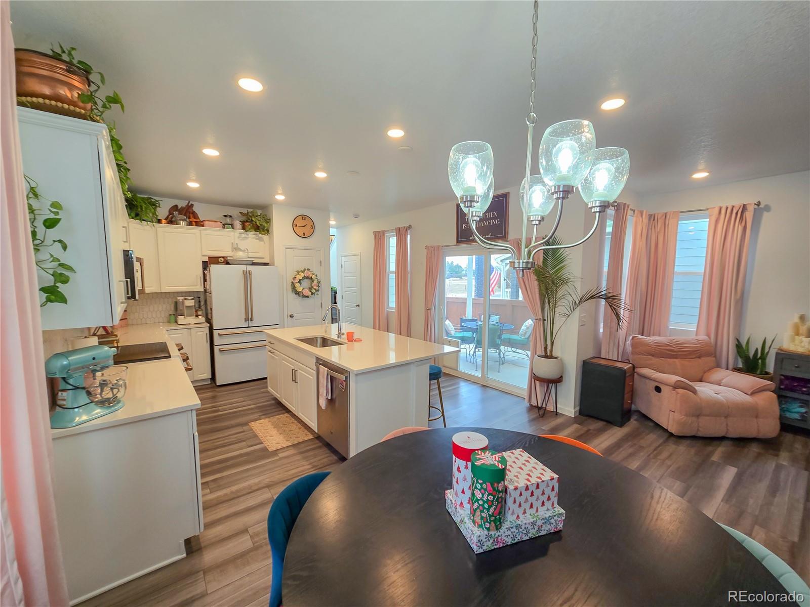 2084 Chambers Road Brighton, CO 80601 - Photo 18 of 50 a very nice looking living room with wooden floor and furniture
