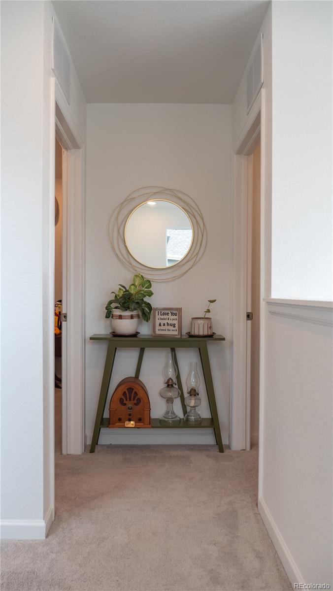 2084 Chambers Road Brighton, CO 80601 - Photo 25 of 50 a view of a livingroom with furniture and bathroom