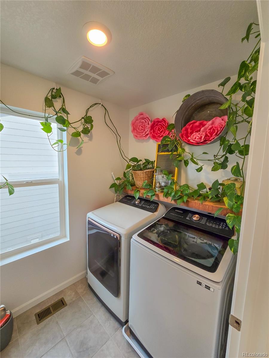 2084 Chambers Road Brighton, CO 80601 - Photo 26 of 50 a very nice looking room with a sink and a window