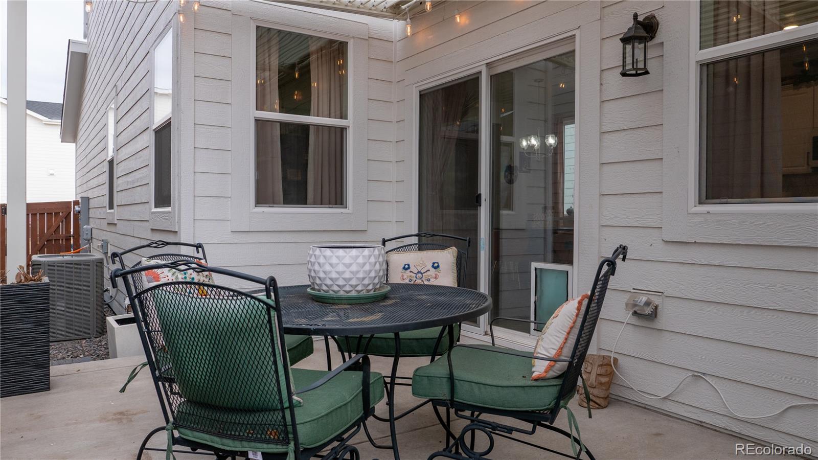 2084 Chambers Road Brighton, CO 80601 - Photo 43 of 50 a couple of chairs sitting in front of a door