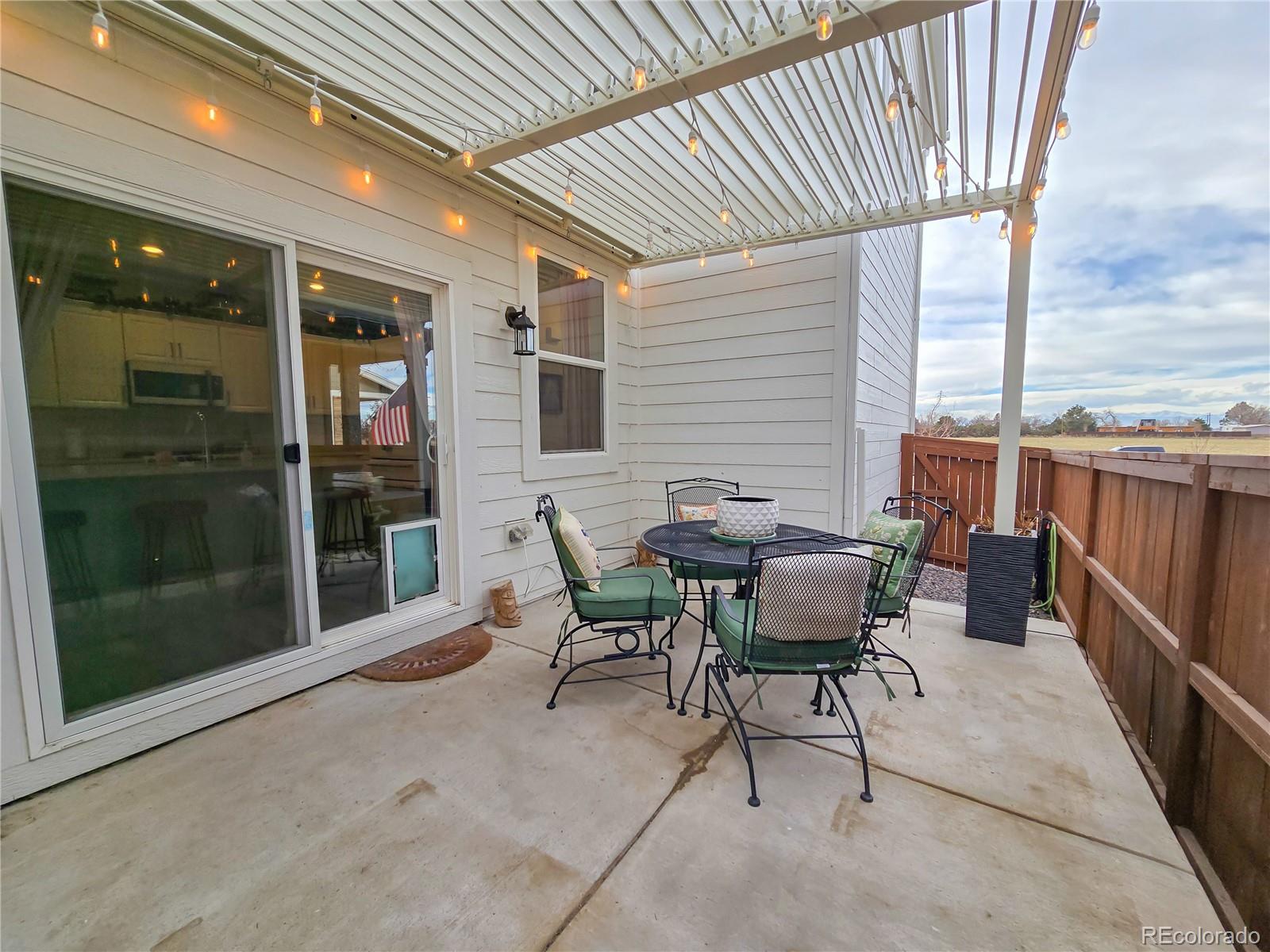 2084 Chambers Road Brighton, CO 80601 - Photo 44 of 50 a patio with table and chairs
