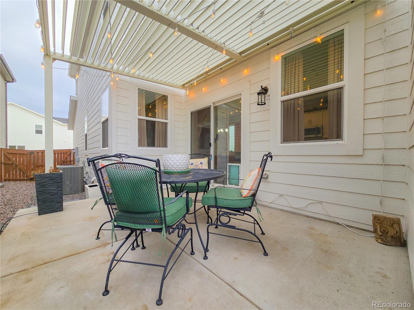 2084 Chambers Road Brighton, CO 80601 - Photo 45 of 50 a view of a house with outdoor seating space