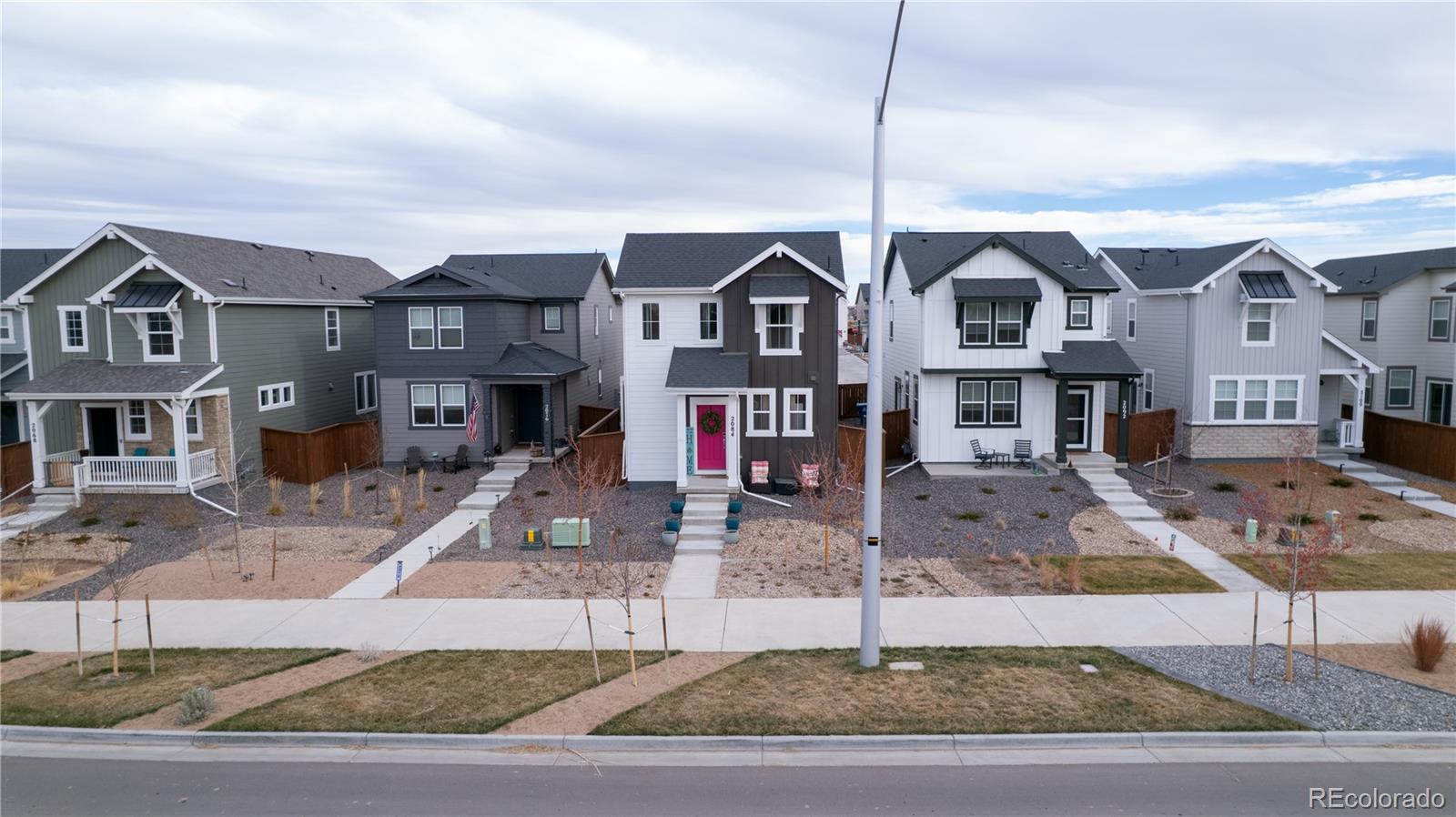 2084 Chambers Road Brighton, CO 80601 - Photo 50 of 50 a front view of multiple houses
