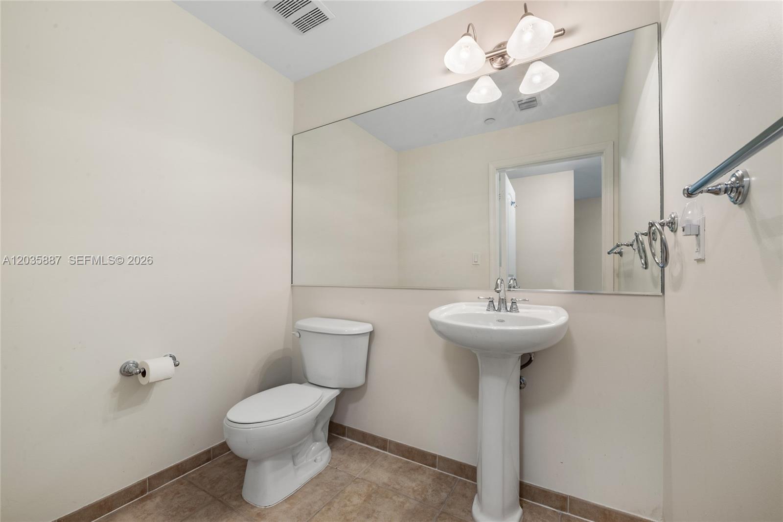 7375 Southwest 90th Street, Unit TH107 Miami, FL 33156 - Photo 12 of 18 Guest Bathroom