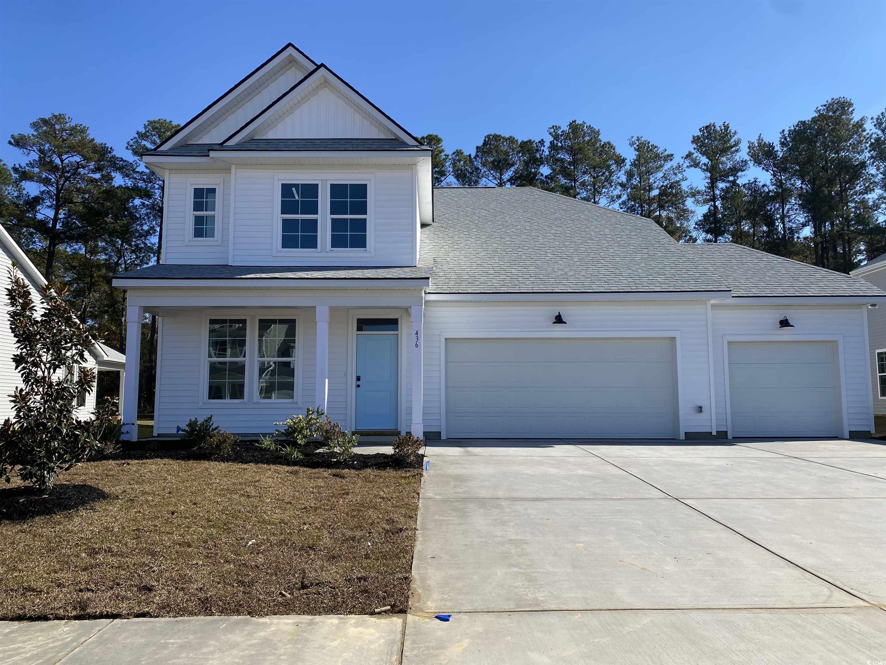 436 Joseph Street Longs, SC 29568 - Photo 1 of 29 View of front facade with concrete driveway, roof with shingles, a garage, and board and batten siding