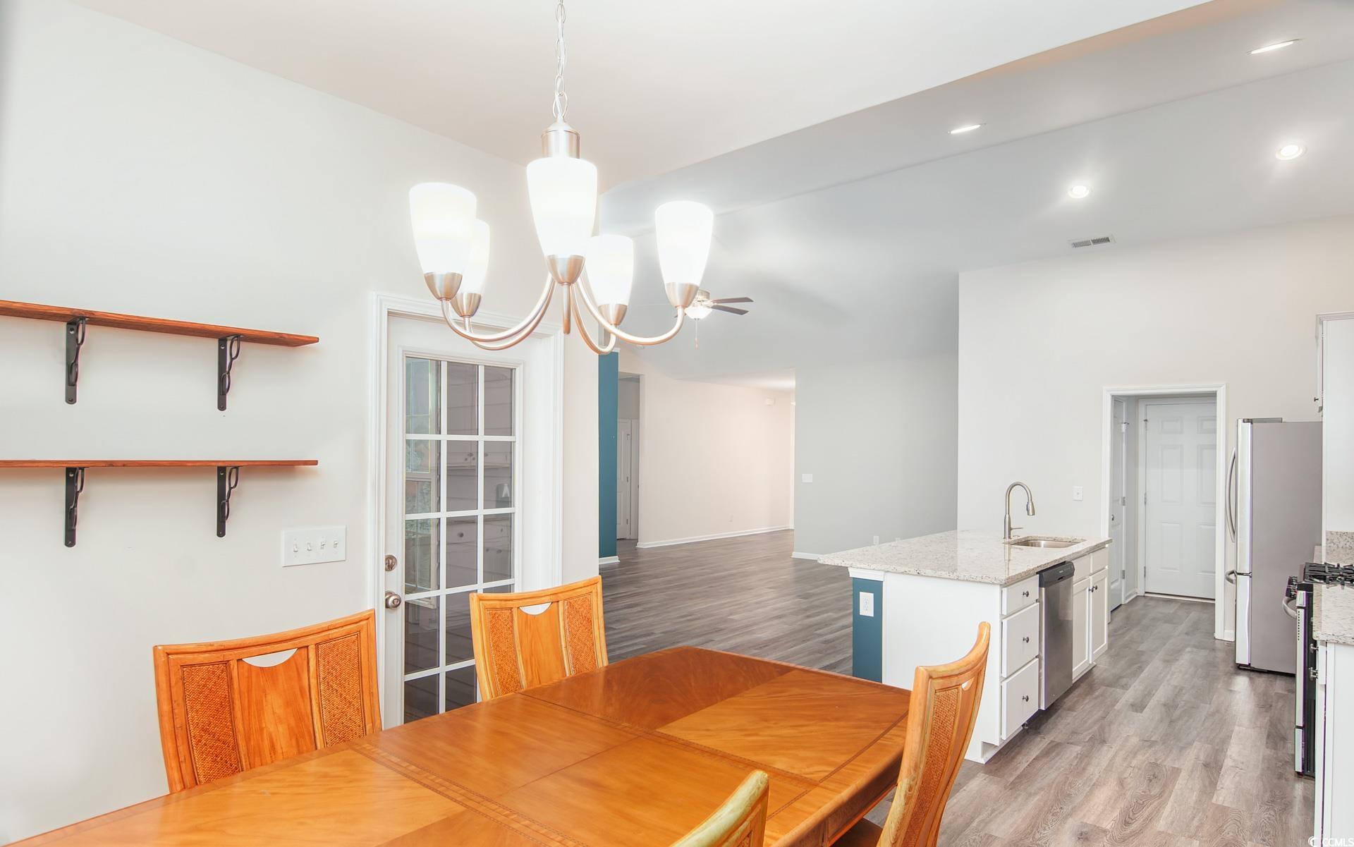531 Charlton Boulevard Georgetown, SC 29440 - Photo 9 of 19 Dining area featuring light wood-style flooring, a chandelier, and recessed lighting