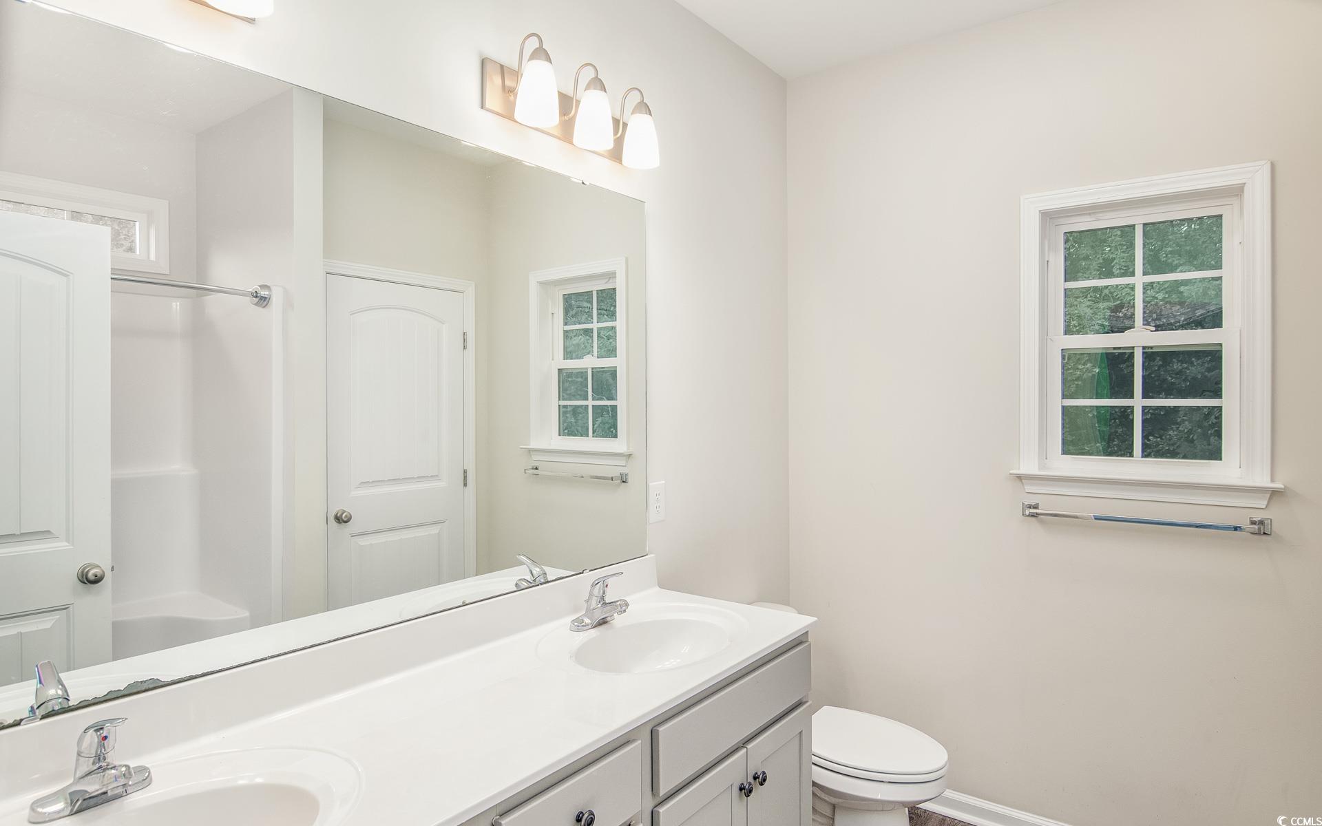 531 Charlton Boulevard Georgetown, SC 29440 - Photo 11 of 19 Full bath featuring double vanity and toilet