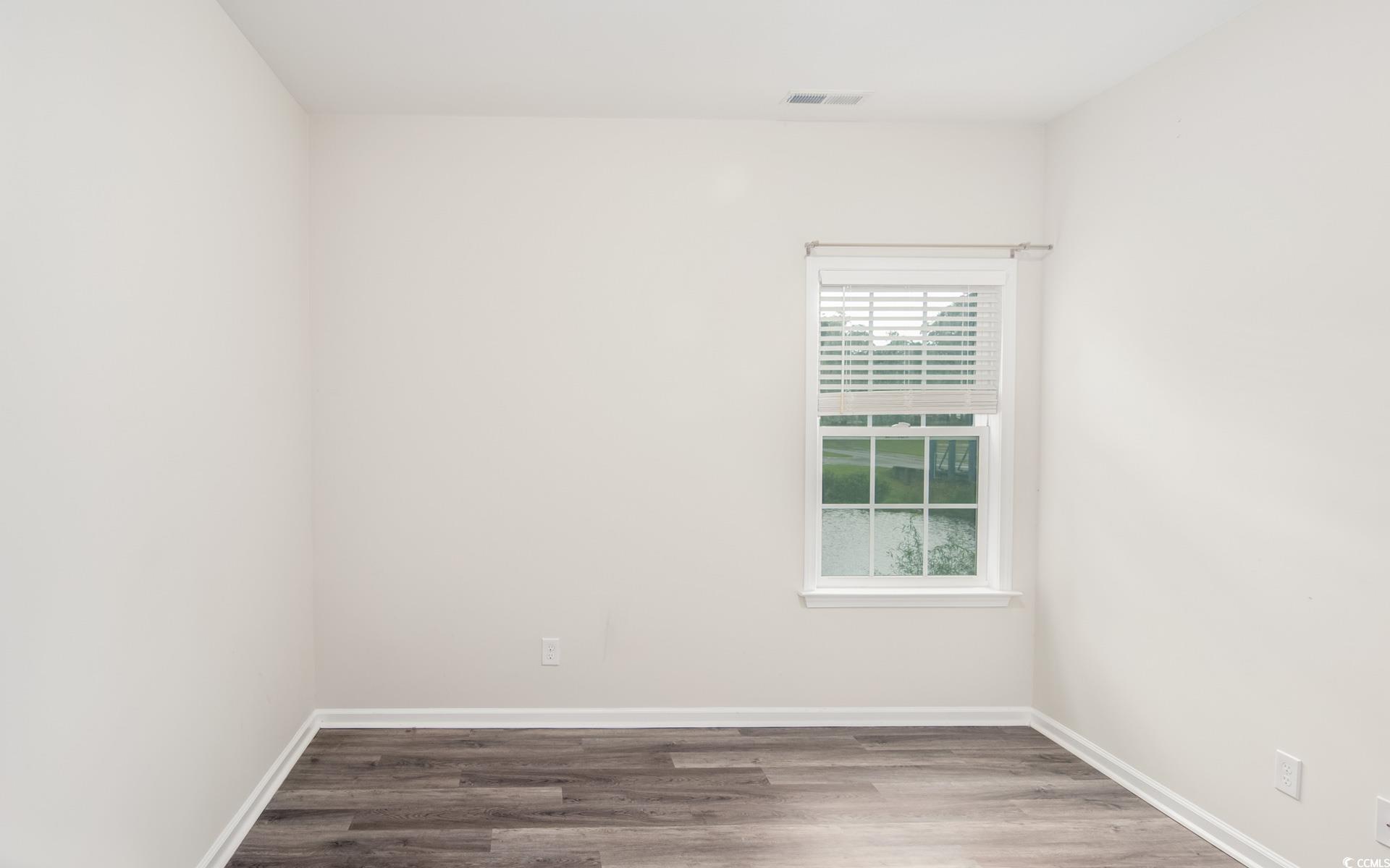 531 Charlton Boulevard Georgetown, SC 29440 - Photo 12 of 19 Unfurnished room featuring wood finished floors and baseboards