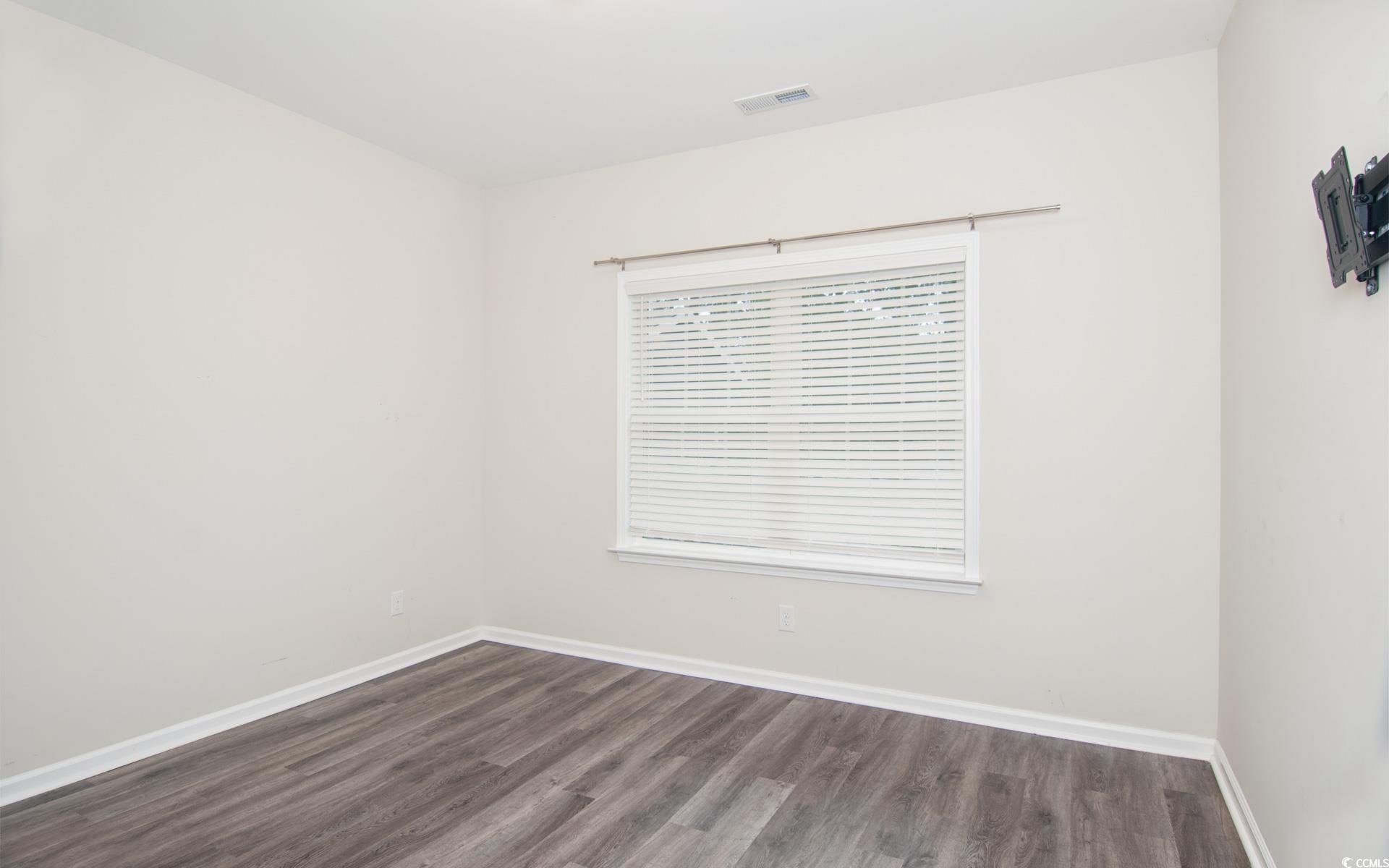 531 Charlton Boulevard Georgetown, SC 29440 - Photo 14 of 19 Spare room featuring dark wood-type flooring and baseboards