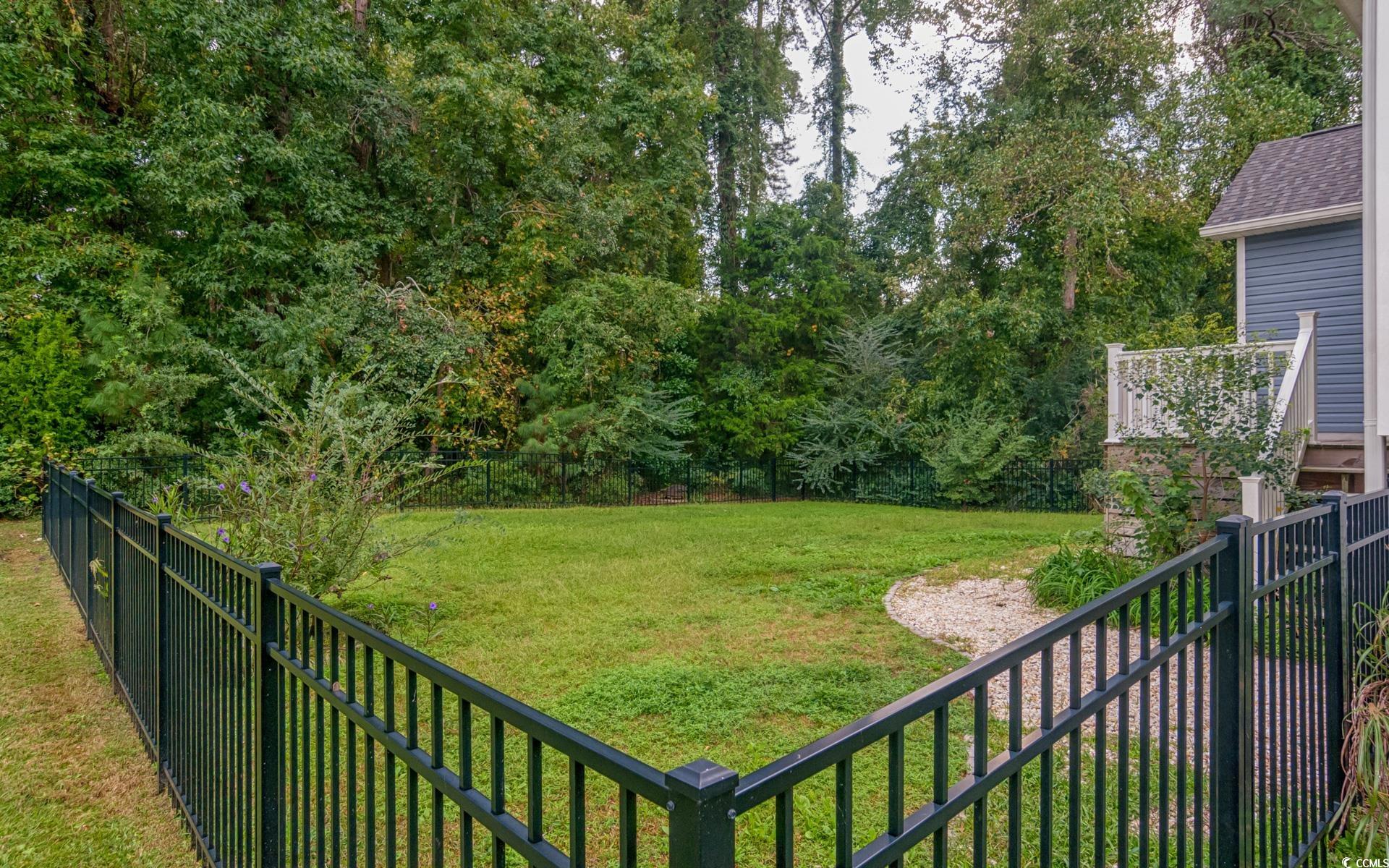531 Charlton Boulevard Georgetown, SC 29440 - Photo 16 of 19 Fenced backyard with view of wooded area