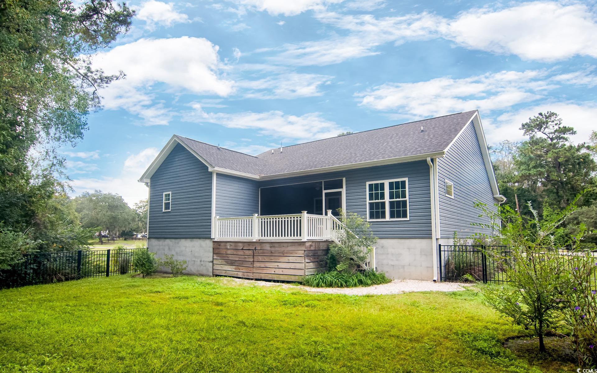 531 Charlton Boulevard Georgetown, SC 29440 - Photo 4 of 19 View of front of property featuring a wooden deck and roof with shingles