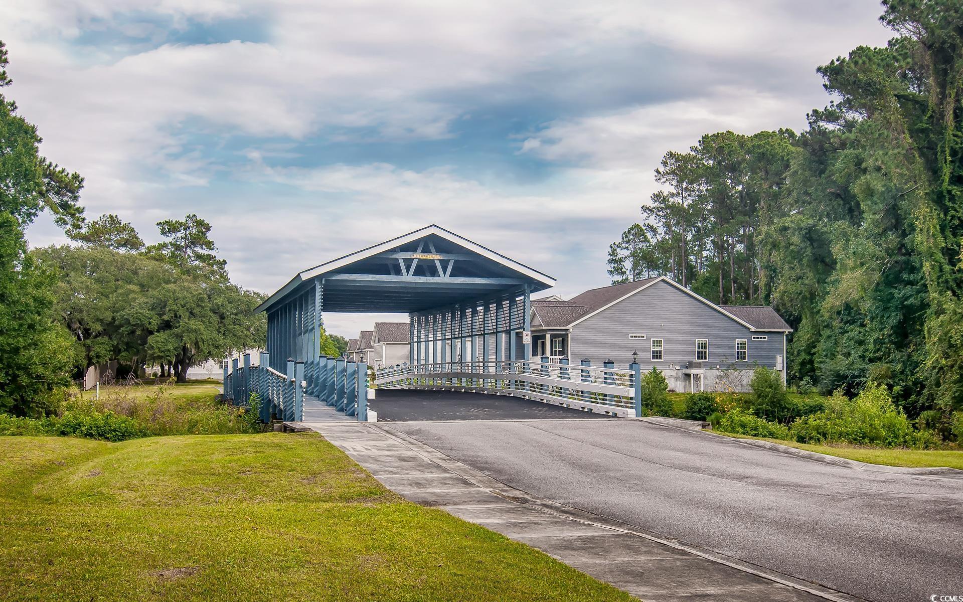 531 Charlton Boulevard Georgetown, SC 29440 - Photo 5 of 19 View of front of property with a detached carport, a front lawn, and driveway