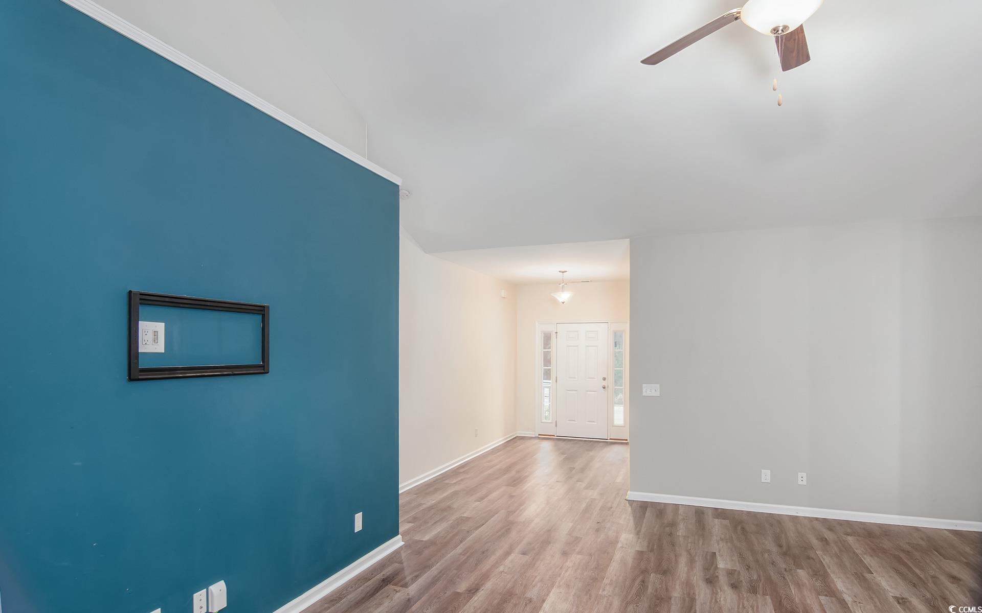531 Charlton Boulevard Georgetown, SC 29440 - Photo 7 of 19 Unfurnished room with wood finished floors and a ceiling fan