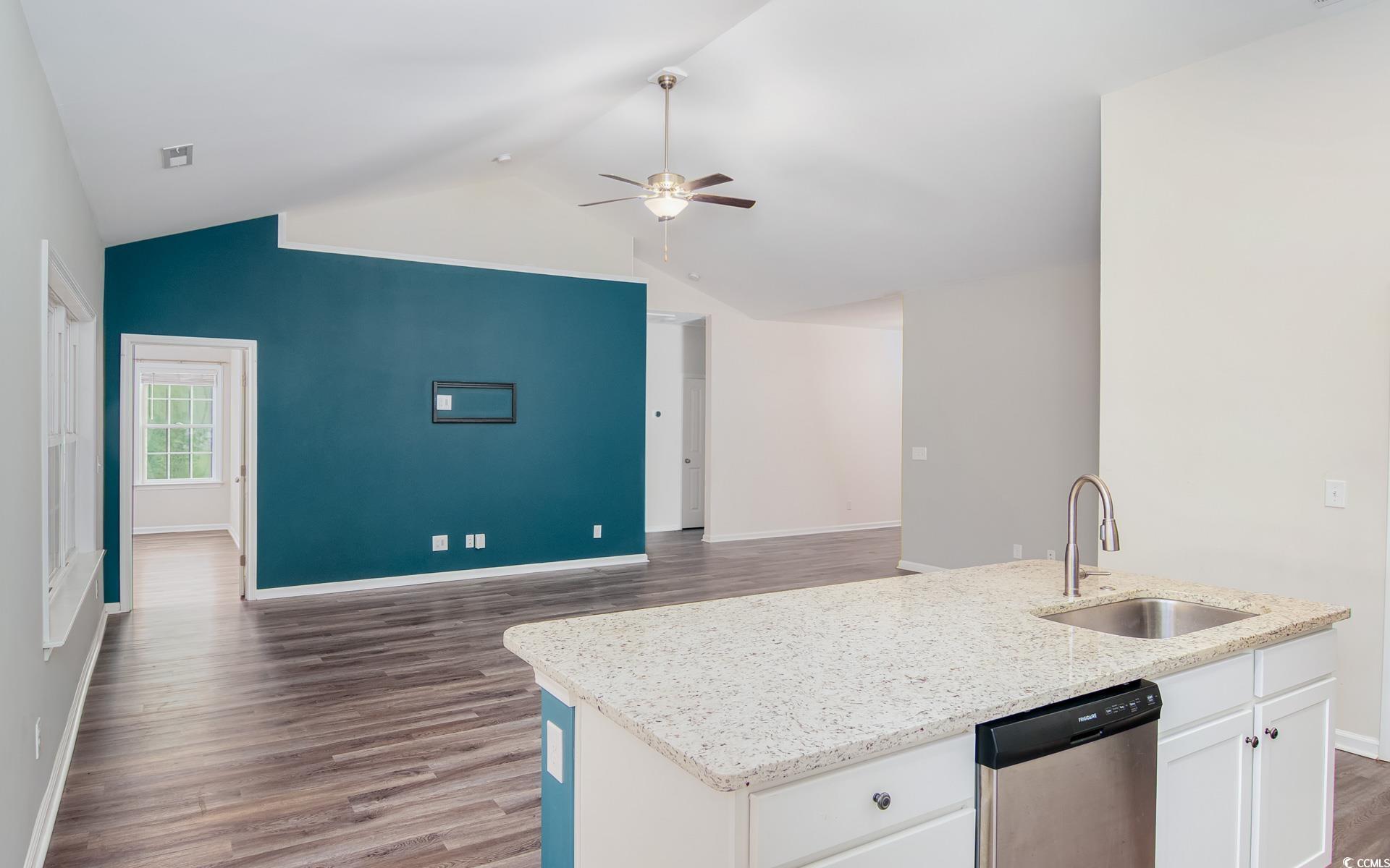 531 Charlton Boulevard Georgetown, SC 29440 - Photo 19 of 19 Kitchen with a kitchen island with sink, dark wood-style flooring, dishwasher, open floor plan, and high vaulted ceiling