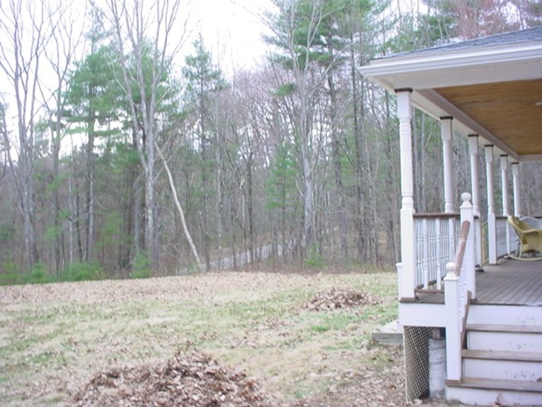 420 Cutler Road Barre, MA 01005 - Photo 4 of 30 a backyard of a house with large trees and wooden fence