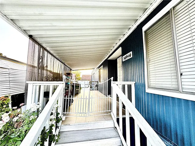 a view of a balcony with wooden floor