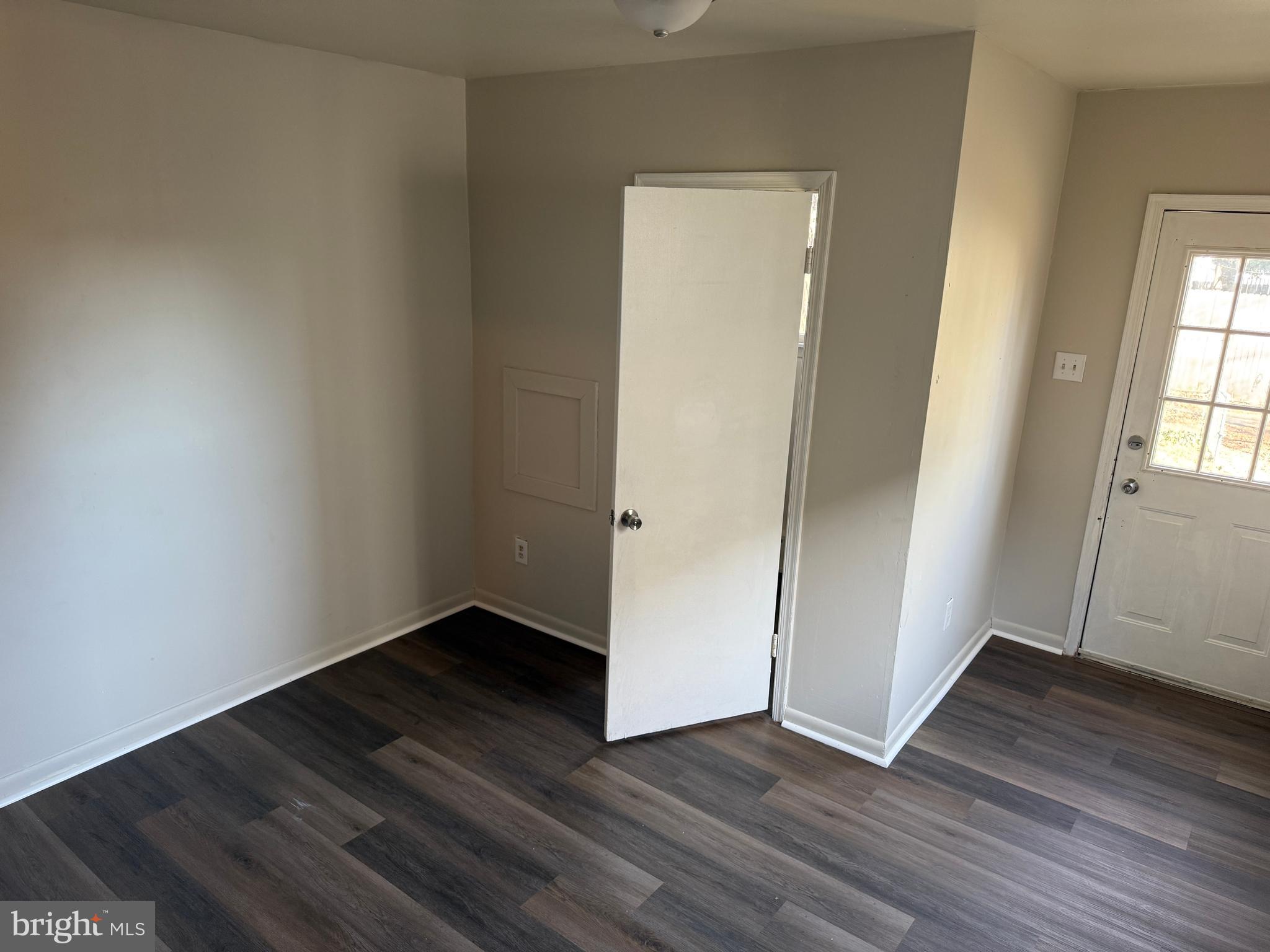 31 Bispham Street, Unit A Mount Holly, NJ 08060 - Photo 5 of 5 an empty room with wooden floor and windows
