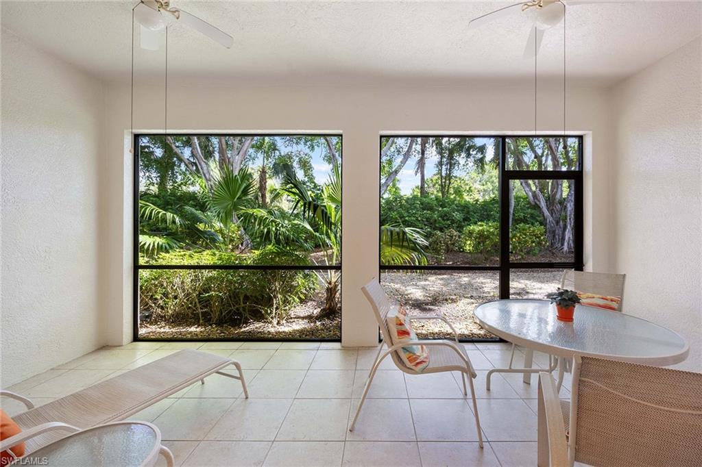 3955 Deer Crossing Court, Unit 103 Naples, FL 34114 - Photo 29 of 40 a room with a large window