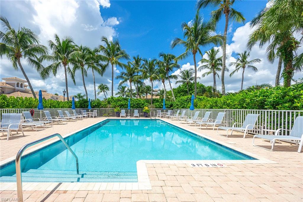 3955 Deer Crossing Court, Unit 103 Naples, FL 34114 - Photo 32 of 40 a view of swimming pool with a patio