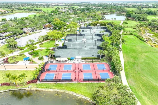 a view of a swimming pool with a yard and mountain view