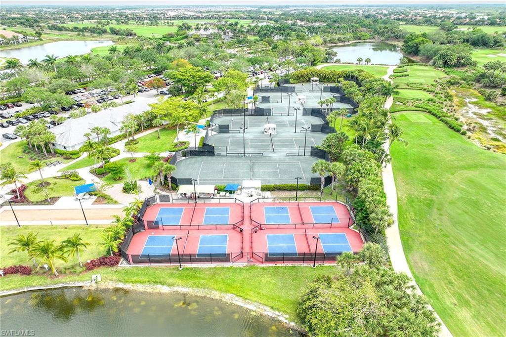 3955 Deer Crossing Court, Unit 103 Naples, FL 34114 - Photo 34 of 40 a view of a city with tall buildings