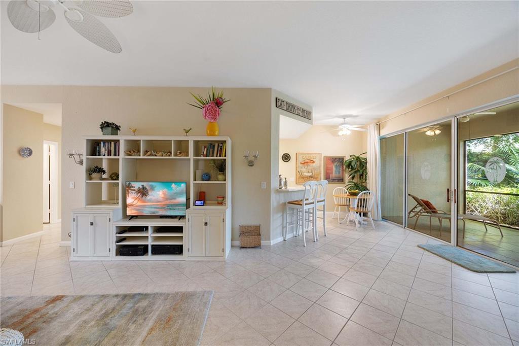 3955 Deer Crossing Court, Unit 103 Naples, FL 34114 - Photo 10 of 40 a view of work space with chairs