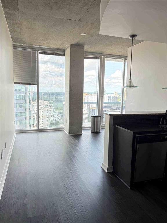 3324 Peachtree Road, Unit 2213 Atlanta, GA 30326 - Photo 3 of 28 an empty room with wooden floor and windows