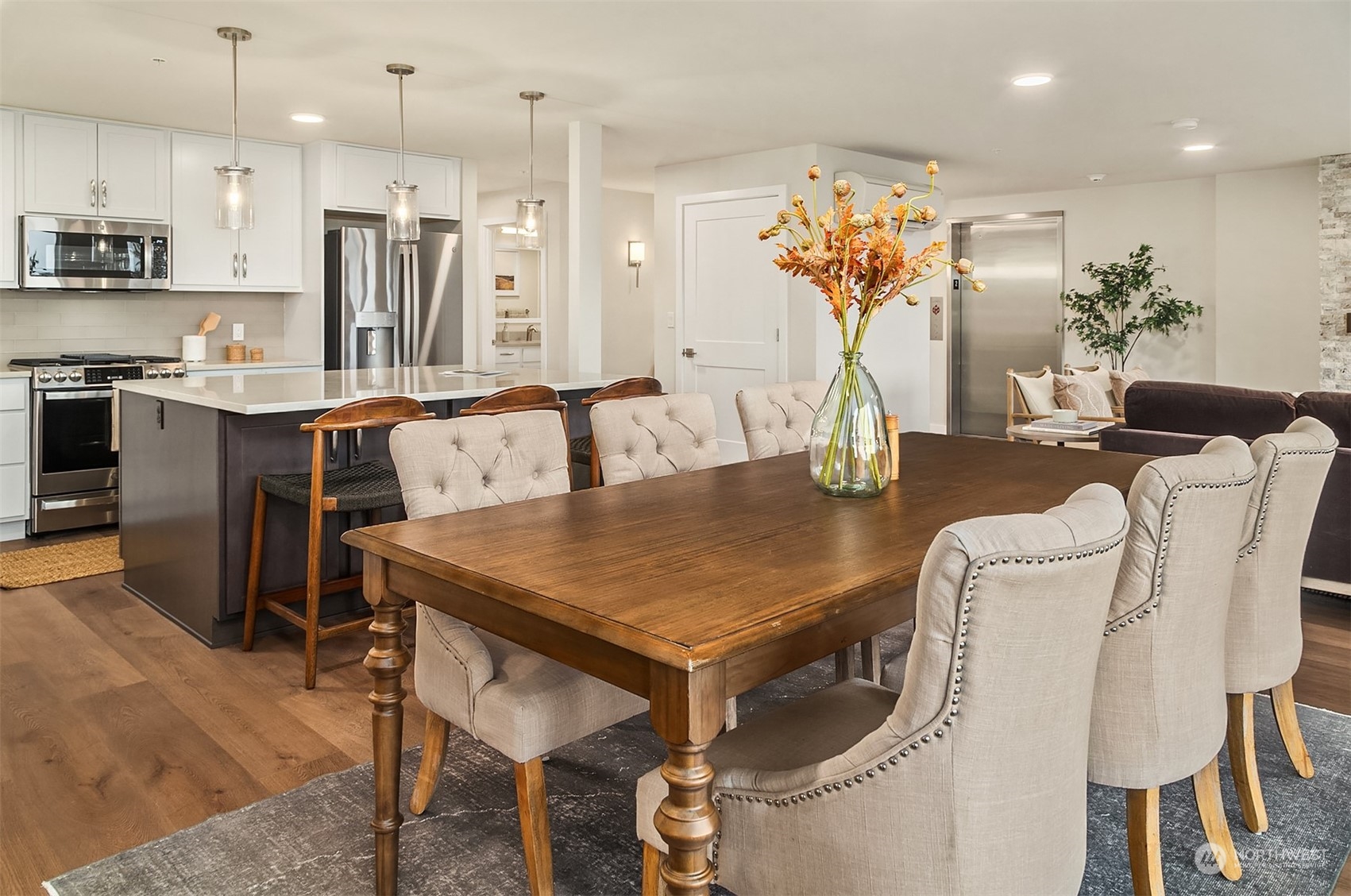 546 Paradise Lane, Unit A202 Edmonds, WA 98020 - Photo 13 of 30 a view of a dining room with furniture and a chandelier
