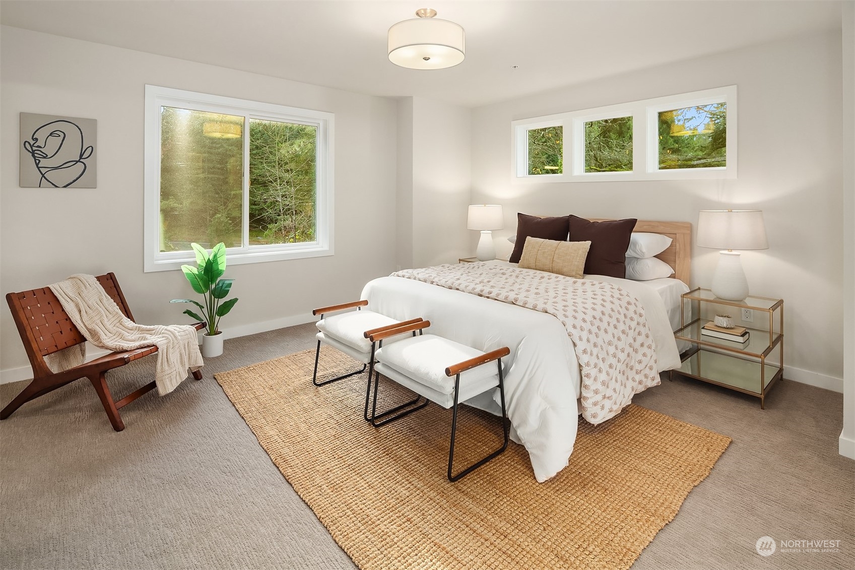 546 Paradise Lane, Unit A202 Edmonds, WA 98020 - Photo 17 of 30 a bedroom with a bed a table and chair