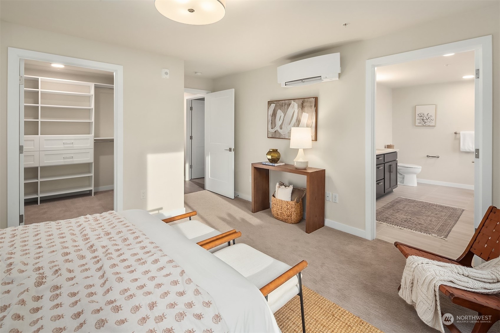 546 Paradise Lane, Unit A202 Edmonds, WA 98020 - Photo 19 of 30 a bedroom with a bed and wooden floor