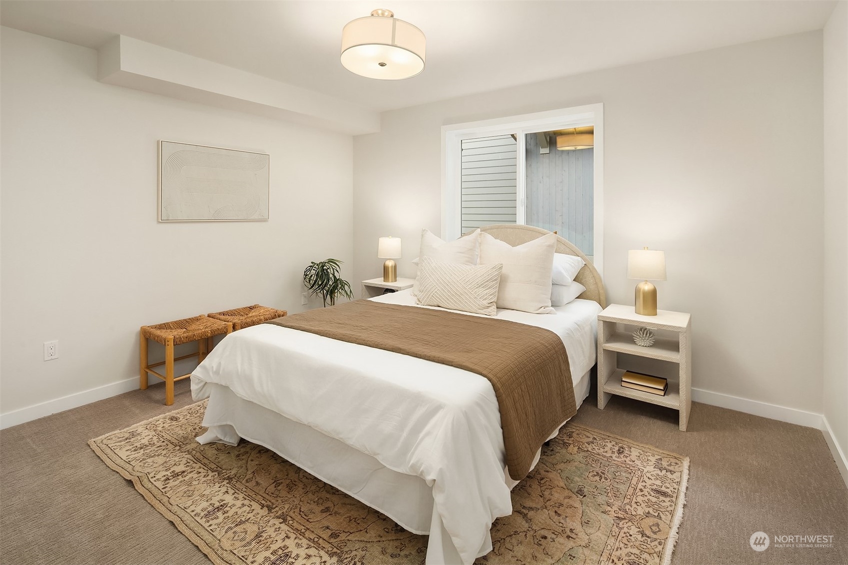 546 Paradise Lane, Unit A202 Edmonds, WA 98020 - Photo 22 of 30 a bedroom with a bed and wooden floor