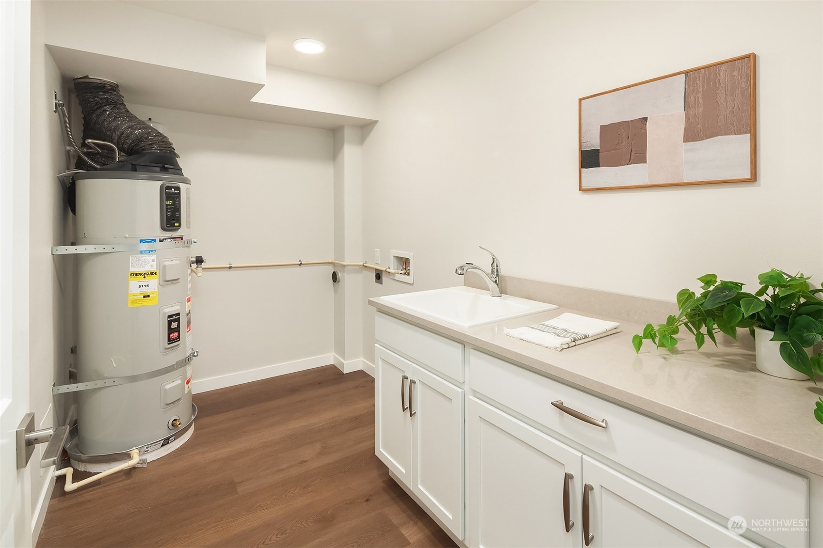 546 Paradise Lane, Unit A202 Edmonds, WA 98020 - Photo 24 of 30 a bathroom with a sink and a mirror