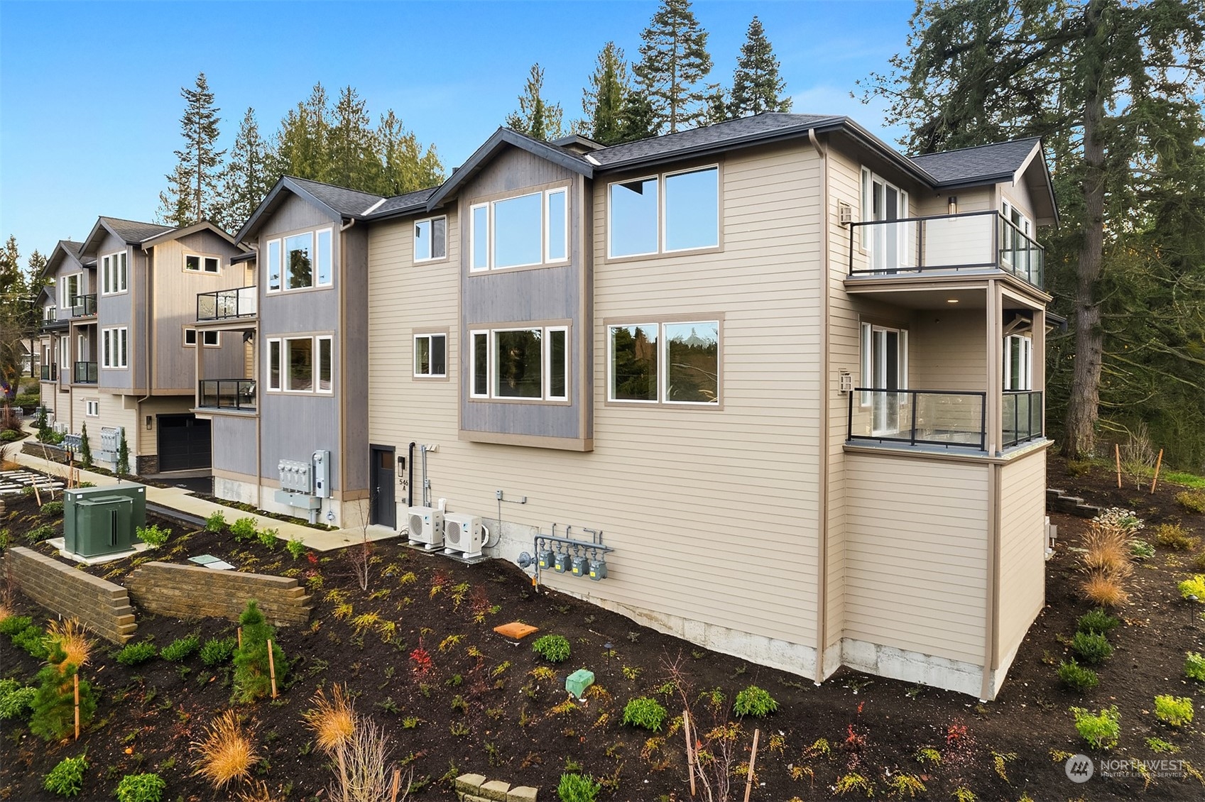 546 Paradise Lane, Unit A202 Edmonds, WA 98020 - Photo 30 of 30 a front view of a house with a garden
