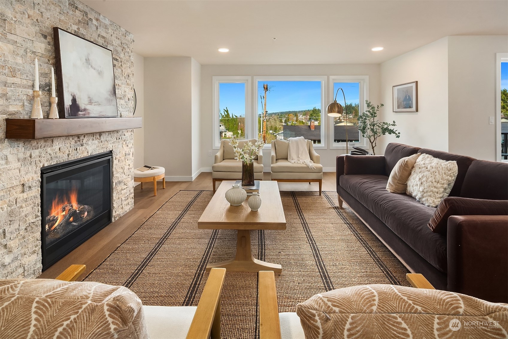 546 Paradise Lane, Unit A202 Edmonds, WA 98020 - Photo 3 of 30 a living room with furniture and a fireplace