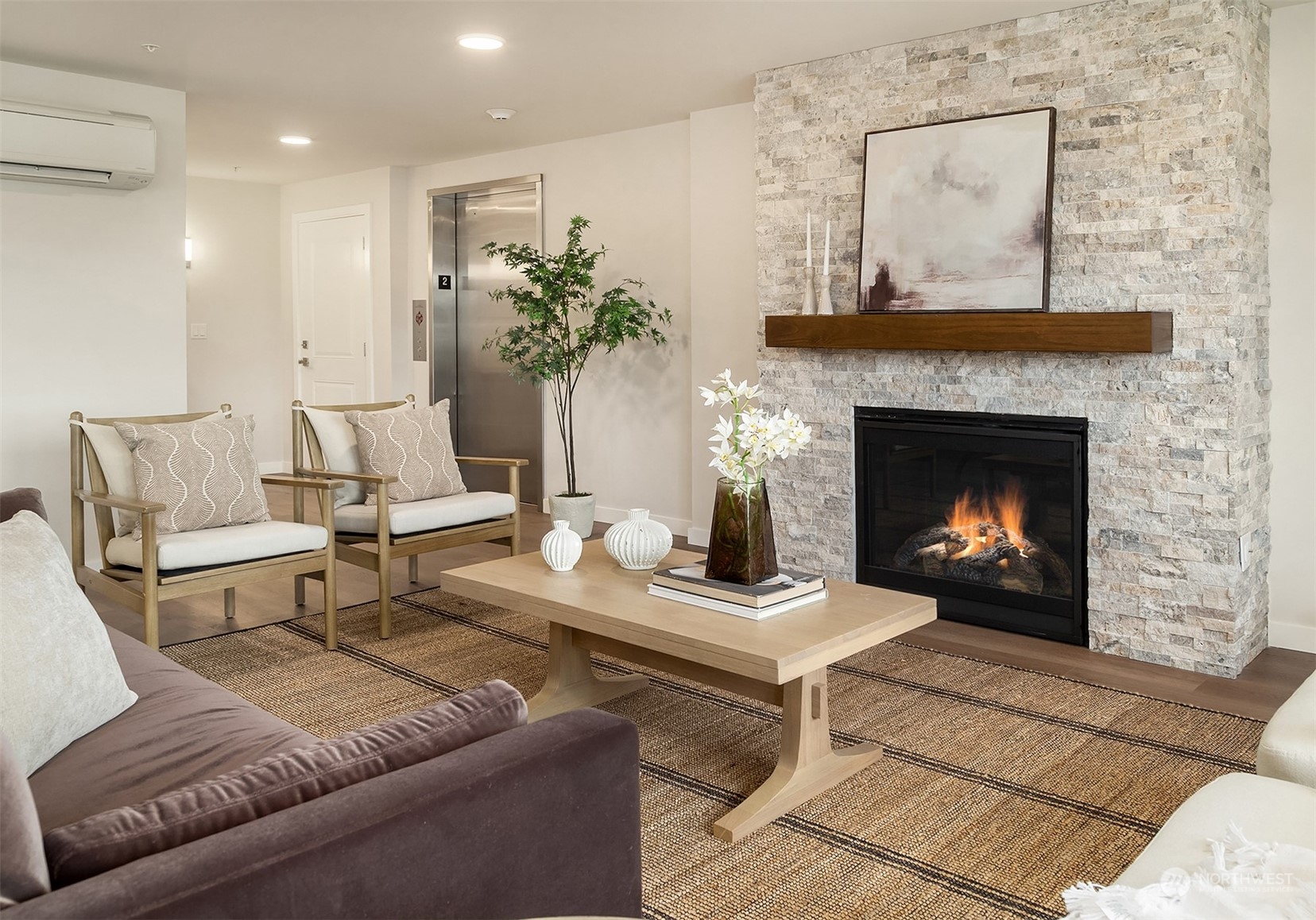 546 Paradise Lane, Unit A202 Edmonds, WA 98020 - Photo 5 of 30 a living room with furniture and a fireplace