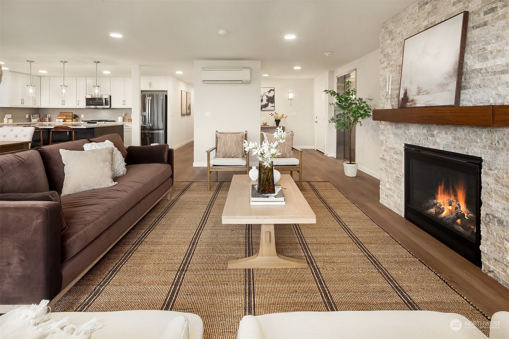 546 Paradise Lane, Unit A202 Edmonds, WA 98020 - Photo 6 of 30 a living room with furniture and a fireplace