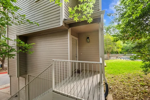 a side view of a house with a yard