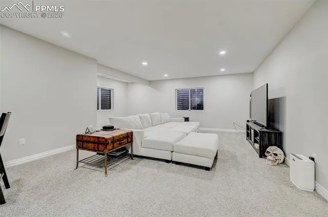 a hotel room with bed and a flat screen tv